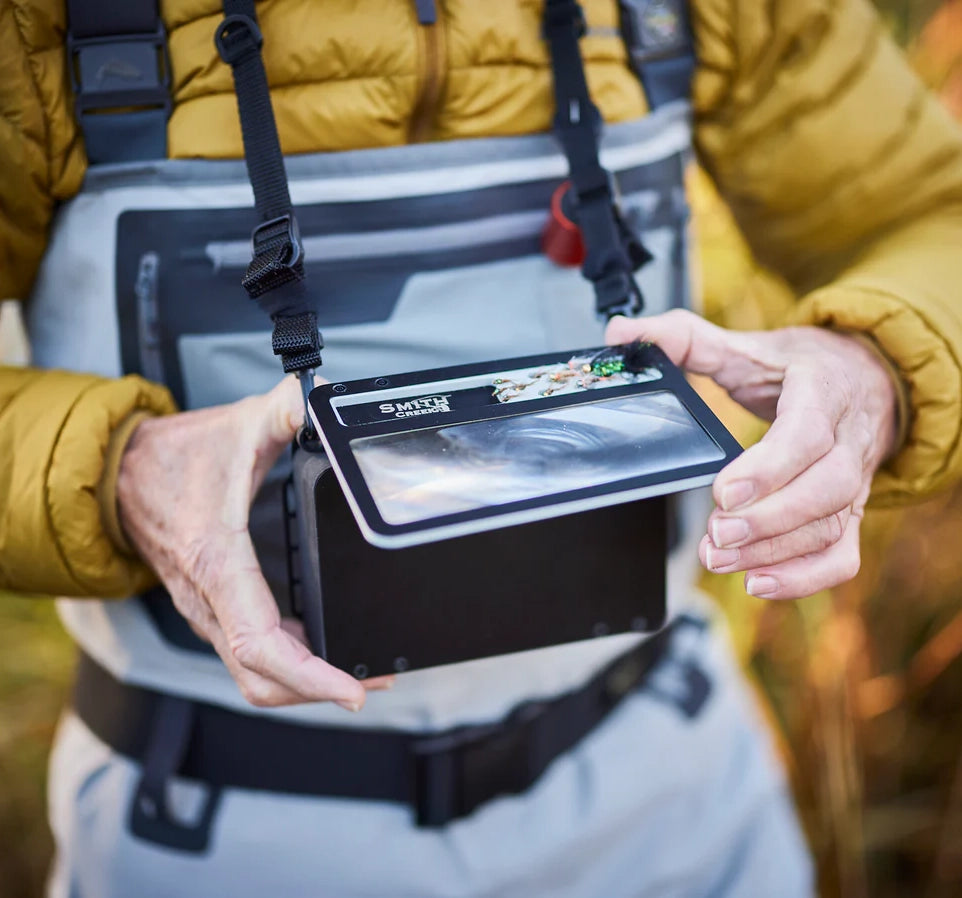 "Angler wearing Smith Creek Fly Vue™ Chest Pack on the water"
