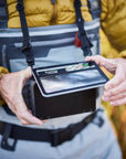 "Angler wearing Smith Creek Fly Vue™ Chest Pack on the water"